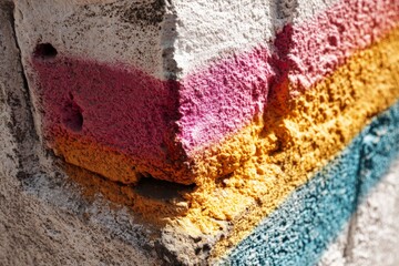 Poster - Vibrant wall art showcasing colorful stripes in urban setting during daylight hours