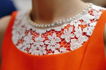 Aufkleber - Elegant orange dress featuring lace detailing and sparkling necklace at a fashion event