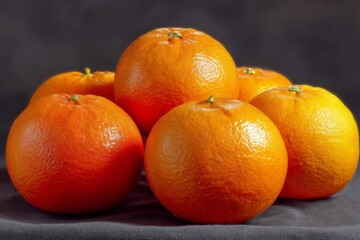 Aufkleber - Fresh oranges stacked in a visually appealing arrangement against a dark background
