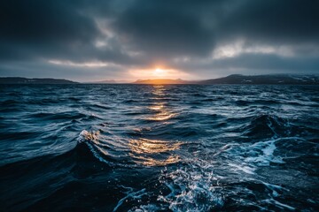 Aufkleber - Sunset over the ocean with dark clouds gathering on the horizon, creating a dramatic seascape in the evening light
