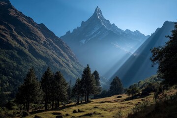 Aufkleber - Majestic mountain peak illuminated by sunlight in a serene valley surrounded by lush greenery