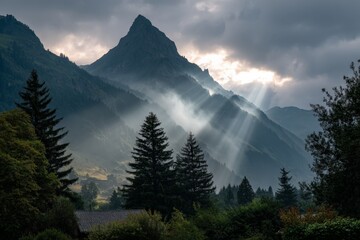 Aufkleber - Romantic rays of sunlight break through clouds in a serene mountain landscape at dawn