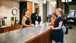 © Flamingo Images - Casual Office Meeting with Colleagues Enjoying Coffee Break at Work. They are standing relaxed in a canteen. There is a happy and positive vibe around them.