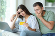 © Antonioguillem - Worried couple having trouble paying online at home