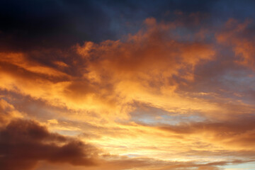 Poster - Golden morning sky with sunrise, warm orange and yellow clouds, dramatic and peaceful atmosphere, natural beauty, early dawn light, tranquil and inspiring scene
