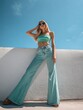 © Ламина Акулова - Fashion forward. Girl in wide leg faded jeans and mint crop top for summer style inspiration