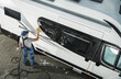 © Tomasz Zajda - Professional Cleaning of a Recreational Vehicle Takes Place in a Driveway During Daylight Hours