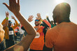© Jacob Lund - Group of runners celebrating with high fives after event