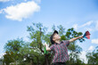 © Austockphoto - Young boy flying a paper plane outside