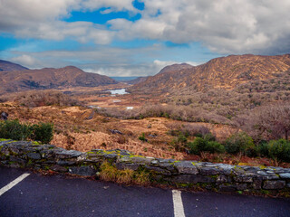 Wall Mural - Stunning nature scene with lake in a valley, mountains and blue cloudy sky. Killarney area of Ireland. Travel and tourism. Irish nature landscape scene. Nobody.