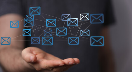 Leinwandbilder - Image of interconnected email icons above a hand, representing global communication and networking.