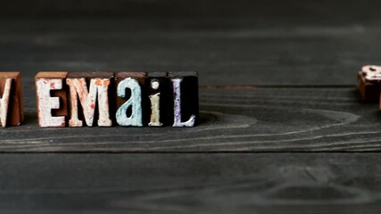 Canvas Print - new email concept. alphabet blocks on a wooden texture background. 4k video