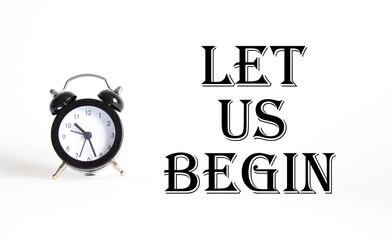 Wall Mural - let us begin symbol. concept word let us begin on beautiful white background with alarm clock. busin