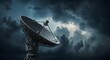 © Mike Ebony - A satellite dish pointed toward gathering storm clouds