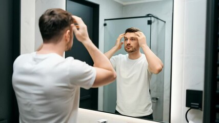 Poster - Man Combing Hair in Bathroom Mirror