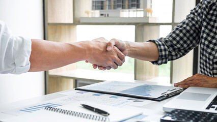 Fototapete - Business casual team shaking hands after a meeting and conference to sign agreement and become partner in the office, results of their successful teamwork, contract between their firms