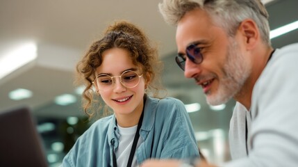 Aufkleber - Smiling Young Woman and Mature Man Working Together on Laptop, Illustrating Mentorship and Intergenerational Collaboration in Modern Workplace, For Business Solutions : Generative AI