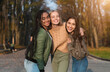© Prostock-studio - Trio pretty multiethnic cheerful teen girls posing in public park