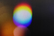 © Uuganbayar - Blur colorful rainbow crystal light leaks on black background. Defocused abstract multicolored retro film lens flare bokeh analog photo overlay or screen filter effect. Glow Vintage prism colors