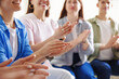 © New Africa - People applauding during meeting indoors, closeup view