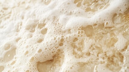Poster - Close-Up View of Creamy White Foam on a Light Brown Surface, Capturing the Natural Texture and Patterns in a Soft and Organic Aesthetic for Artistic and Commercial Use