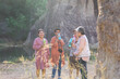 © Rakchanok - Group of Asian retirement women travelling, hiking, walking togehter in park, senior pensioner friends spend time exercise trekking in forest, unrecognizable elderly tourist lifestyle one day trip