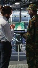 Poster - Vertical video Military IT specialists in server hub using laptop scanner tools to oversee battlefield during warfare. Army data center admins doing transmission analysis and live UAV system