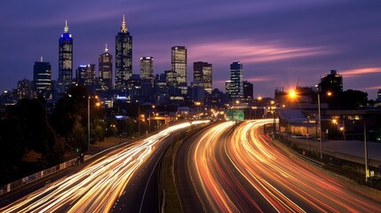 Poster - Blurred motion effect of a highway with streaks of car lights, conveying high-speed movement against a nighttime cityscape