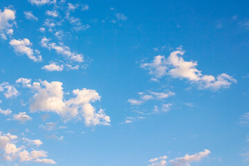 Wall Mural - blue sky with clouds on a sunny august morning. climate change. fluffy formations in bright weather.