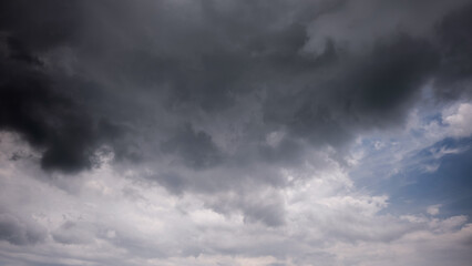 Wall Mural - dark sky with stormy clouds. dramatic sky rain,dark clouds before a thunder-storm,clouds before rain