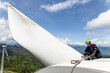 © Westend61 - Engineer performing maintenance on a wind turbine nacelle outdoors