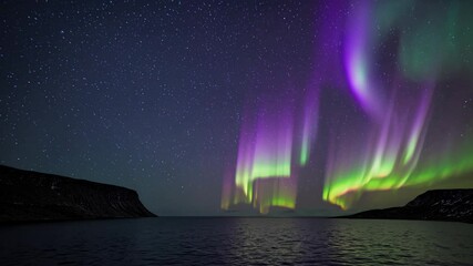 Wall Mural - Northern lights swirling above dark sea waters, luminous green rays reflecting on calm ocean surface during polar night