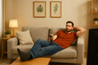 © Inna - young man watching tv