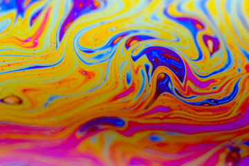 Vivid swirling colors on soap film macro textures