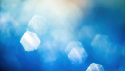 Poster - defocused blue bokeh lights with hexagonal highlights and soft glow for abstract background, web design texture, branding element or modern digital print layout

