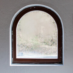 Wall Mural - A window with a brown frame and a white frame