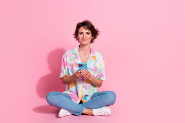 Poster - Full body portrait of nice young woman use phone wear shirt isolated on pink color background