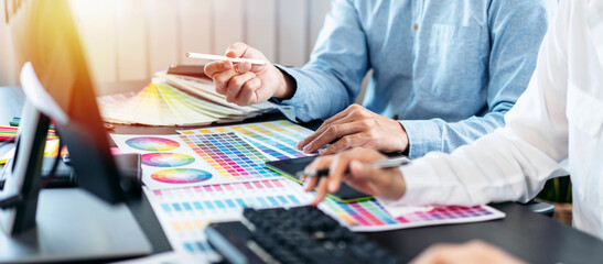 Poster - Team of creative graphic designer working on color swatch samples chart for selection coloring in inspiration to create new collection at workplace