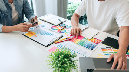 Poster - Team of creative graphic designer working on color swatch samples chart for selection coloring in inspiration to create new collection at workplace