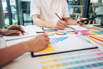 Poster - Team of creative graphic designer working on color swatch samples chart for selection coloring in inspiration to create new collection at workplace