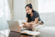 © Freedomz - Asian freelance woman entering information of credit card to receive payment and check balance in banking app
