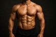© Boke - Bodybuilder showing his well defined abs and strong arms