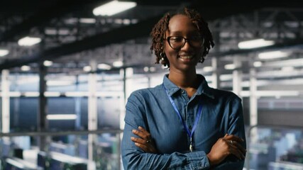 Poster - portrait of smiling data center admin next to coworkers running diagnostics on equipment to identify
