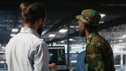 Poster - Military units overseeing AI computing operations on notebook in high tech server facility. Army tech experts using machine learning intelligence to oversee communication systems