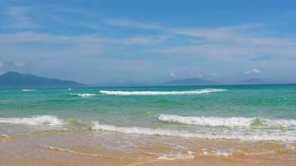 Wall Mural - Landscape of the morning beach with turquoise water and light suns at low tide