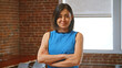 © Monkey Business - Portrait Of Businesswoman In Office Standing By Window