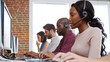 © Monkey Business - Multi-Cultural Business Team Wearing Headsets Working In Busy Customer Service Department