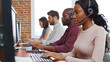 © Monkey Business - Multi-Cultural Business Team Wearing Headsets Working In Busy Customer Service Department