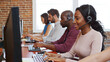 © Monkey Business - Multi-Cultural Business Team Wearing Headsets Working In Busy Customer Service Department