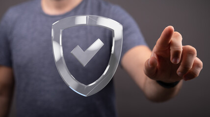 Poster - Person interacting with a digital shield, symbolizing data security and protection.